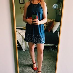 navy dress with white embroidered details